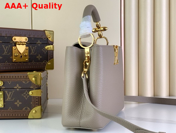 Louis Vuitton Capucines BB Handbag in Galet Gray Taurillon Leather with Golden Monogram Blossom in Metal Replica