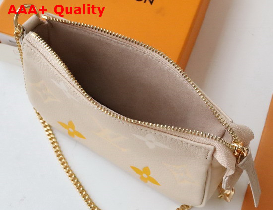 Louis Vuitton Mini Pochette Accessoires Cream Saffron Monogram Empreinte Leather Gradation on the Embossed Monogram Pattern M80501 Replica