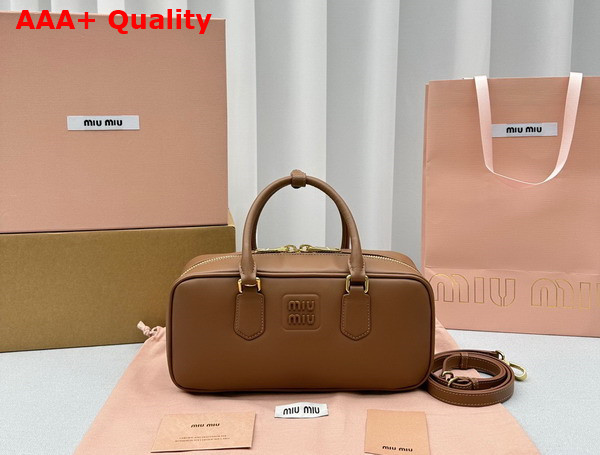 Miu Miu Medium Leather Top Handle Bag in Cognac 5BB148 Replica